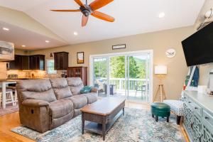 a living room with a couch and a ceiling fan at Winston's Ridge in Fairview