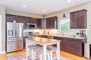 a kitchen with wooden cabinets and a wooden table at Winston's Ridge in Fairview