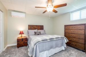 a bedroom with a bed and a ceiling fan at Winston's Ridge in Fairview