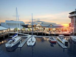 a group of boats are docked at a marina at Tropical Suite PRIVATE CENTRAL BUDDINA STYLE in Buddina