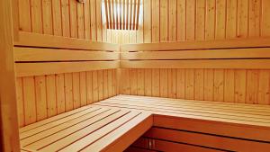 a sauna with wooden paneling and a light at Ferienwohnung-direkt-am-Skihang mit Sauna in Kurort Oberwiesenthal
