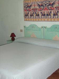 Krevet ili kreveti u jedinici u okviru objekta Hotel Turismo Rurale Montitundu