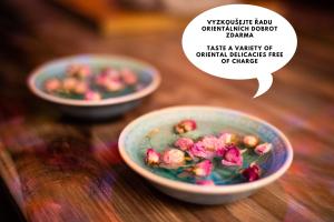 two bowls filled with flowers on a wooden table at OROOM India - Role Play For Couples in BRNO in Brno