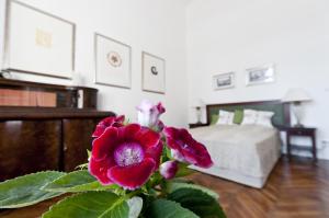 Ένα ή περισσότερα κρεβάτια σε δωμάτιο στο BudaFlats Apartments