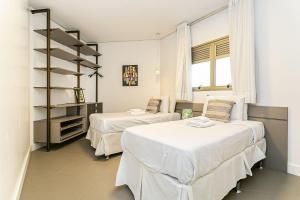 Кровать или кровати в номере WI-FI 200MB | 350m da Praia de Jurerê #JA07 +38 фотографий