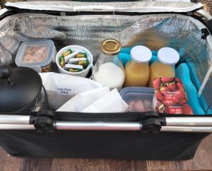 a suitcase filled with food and drinks and other items at Lazy Days B&B in Broadstairs