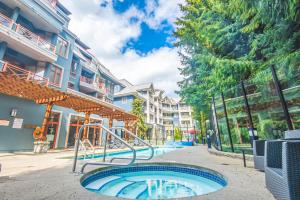 a swimming pool with a playground in a building at Alpenglow Lodge by Elevate Vacations in Whistler
