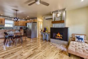 a living room with a fireplace and a dining room at Key Lime Pie in Gatlinburg