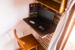 a laptop computer sitting on top of a table at Pico dos Piratas in Itarema