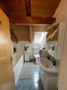 Ένα μπάνιο στο BullsLiving Seeapartment 2 AM CORSO