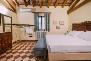Postel nebo postele na pokoji v ubytování Agriturismo Albafiorita