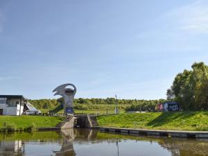 a view of a river with a statue in the middle at Bumbles Barn in Slamannan