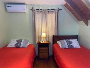 Cama o camas de una habitación en Hospedajes TABOLANGO