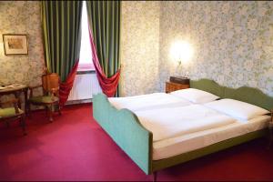 Postel nebo postele na pokoji v ubytování Hotel Hohenstauffen