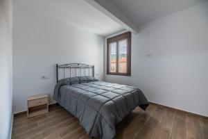 Łóżko lub łóżka w pokoju w obiekcie El Rincón de Ramón II