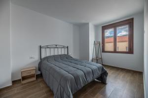 Łóżko lub łóżka w pokoju w obiekcie El Rincón de Ramón II