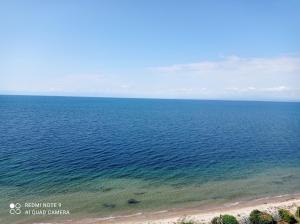 an aerial view of the ocean and a beach at Sunset Apartment in Epanomi