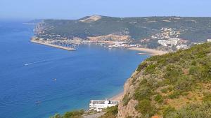 a view of a bay with boats in the water at Ocean View Dive House in Sesimbra
