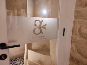 a sign on the door of a room at Valletta Home -Dar il-Kavallier Jacques de Quiqueran in Valletta