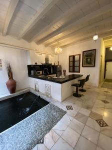 a kitchen with a sink and a counter top at Rumah Warisan Penang in George Town