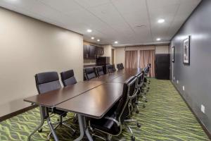 a conference room with a long table and chairs at Best Western PLUS Fort Saskatchewan Inn & Suites in Fort Saskatchewan