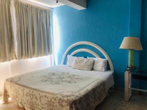 Postel nebo postele na pokoji v ubytování HOTEL Posada Aguascalientes
