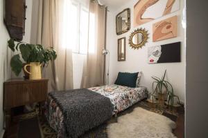 Postel nebo postele na pokoji v ubytování Original apartamento en el corazón de Madrid TRES PE