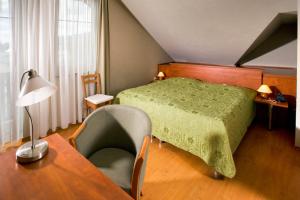 Letto o letti in una camera di Hotel Bešeňová
