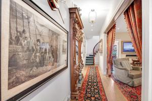 a hallway with a large painting on the wall at Submariners Gate in Annapolis