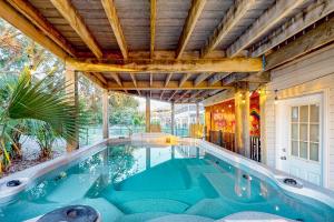 an indoor swimming pool in a house at Island Palms in St. George Island