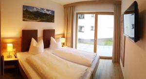 Posteľ alebo postele v izbe v ubytovaní Apart Viva Ischgl