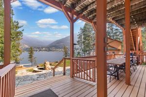 a porch with a table and a view of a lake at Lakeside Landing in Hope