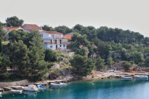 a group of boats are docked in a lake at Apartments by the sea Basina, Hvar - 8749 in Vrbanj