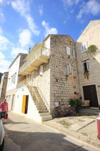 a building with a staircase on the side of it at Apartments by the sea Vis - 2477 in Vis
