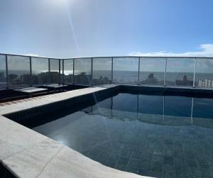 a swimming pool on top of a building at Villi 503C in João Pessoa