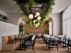 a dining room with long tables and chairs at 1 Hotel San Francisco in San Francisco