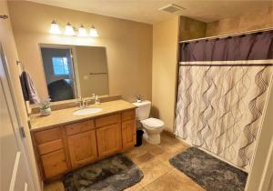 a bathroom with a shower and a sink and a toilet at 1-Bedroom Condo in the Heart of the City in Salt Lake City