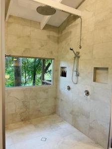 a bathroom with a shower and a sink at Kondalilla Eco Resort in Montville