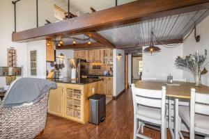 a kitchen and dining room with a table and chairs at Silver Queen West, Building B, Unit 7137 by Summit County Mountain Retreats in Silverthorne