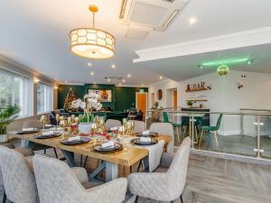 a dining room with a table and chairs at Fairview in Penicuik