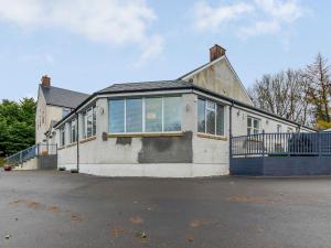 a house with a lot of windows on a street at Fairview in Penicuik