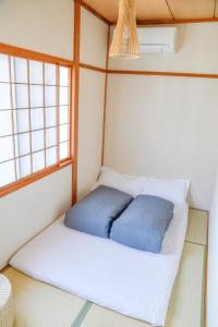 Postel nebo postele na pokoji v ubytování Guesthouse Hakuka