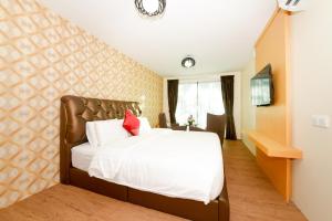 Postel nebo postele na pokoji v ubytování Delta Chenang Resort