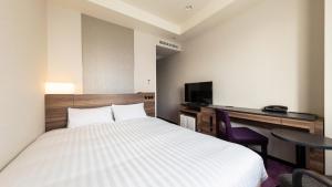 JR-East Hotel Mets Mito客房内的一张或多张床位