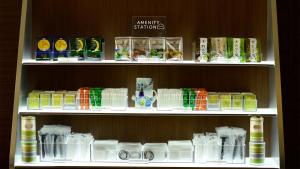 a shelf filled with lots of different types of drinks at JR-East Hotel Mets Komagome in Tokyo