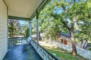 a porch of a house with a tree at Golden Dreams Inn in Grass Valley