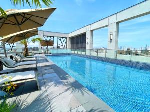 a swimming pool on the roof of a building at Grand Banyan Hotel in Tainan