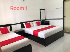 Een bed of bedden in een kamer bij 66 Semi-D Homestay