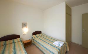 Cama o camas de una habitación en Apartamentos Montserrat Abat Marcet