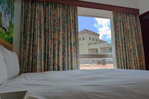 Letto o letti in una camera di Howard Kenting Wonder House